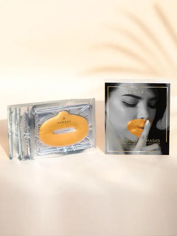 24K gold lip mask for hydration and plumping, with product packaging in natural light