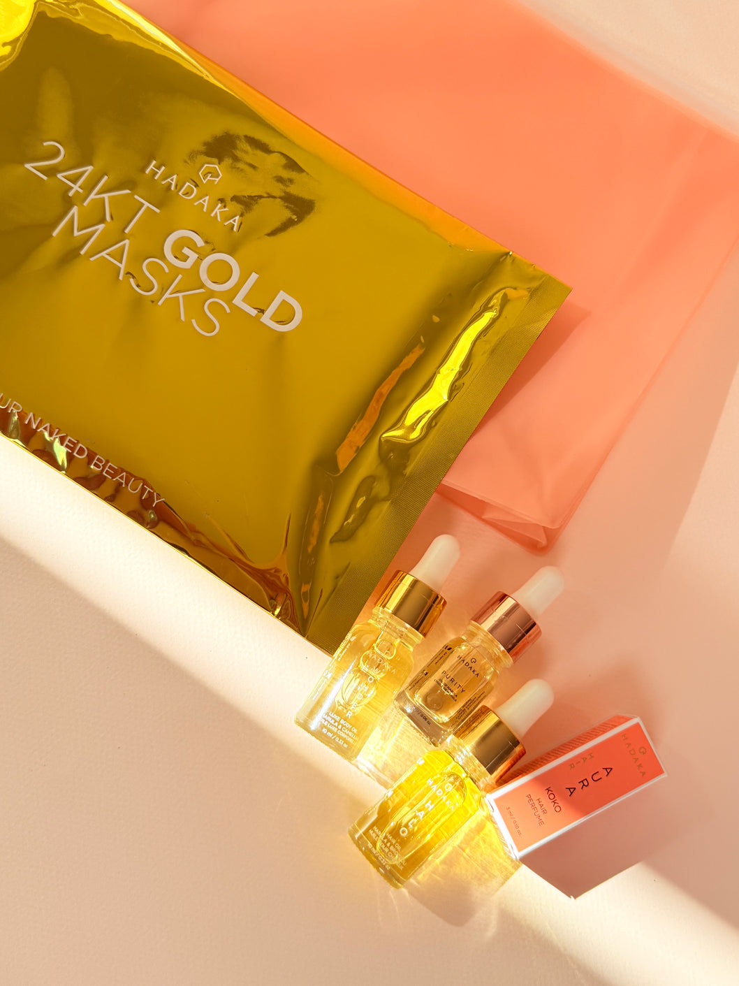 HADAKA GOLD VAULT SET Canada flat lay with skincare and haircare products
