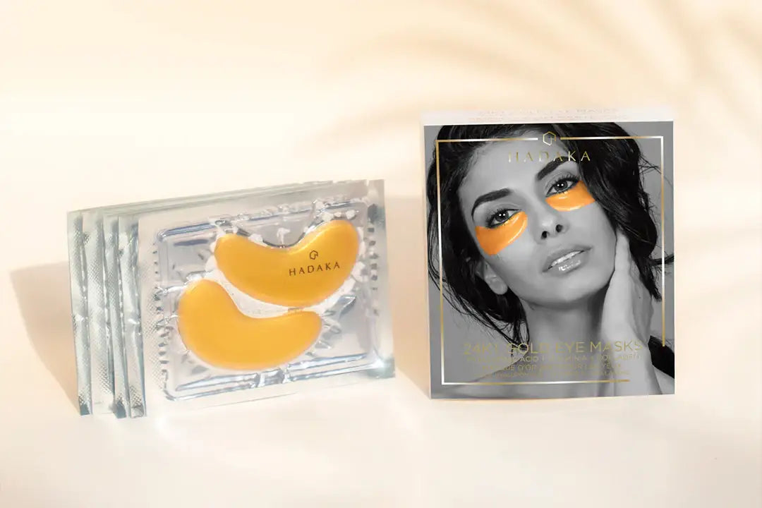 24K gold under eye masks for hydration, anti-aging, packaged with model using the product