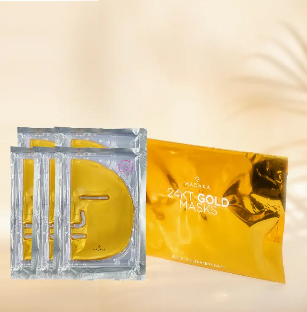 Pack of Hadaka 24KT gold face masks in shiny gold packaging with sheet masks displayed
