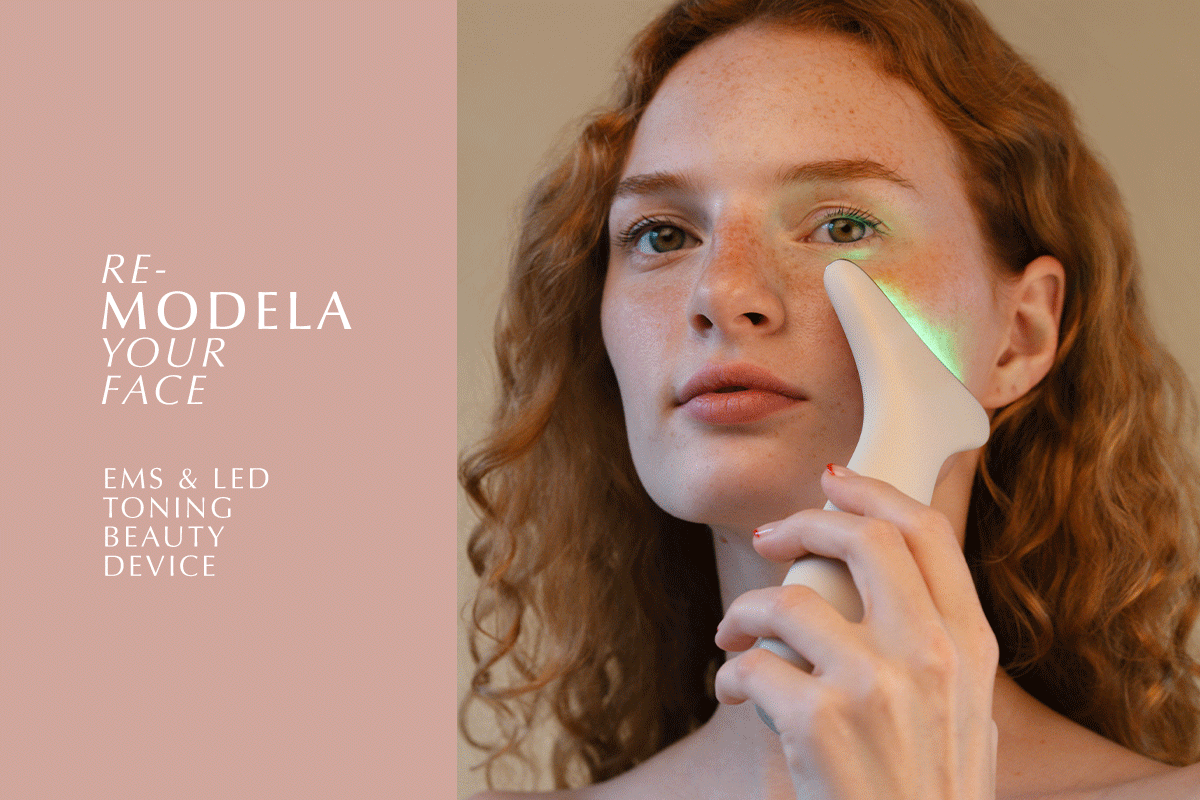 redhead Model with HADAKA MODELA EMS & LED Beauty device with red led light to tone fccial muscles
