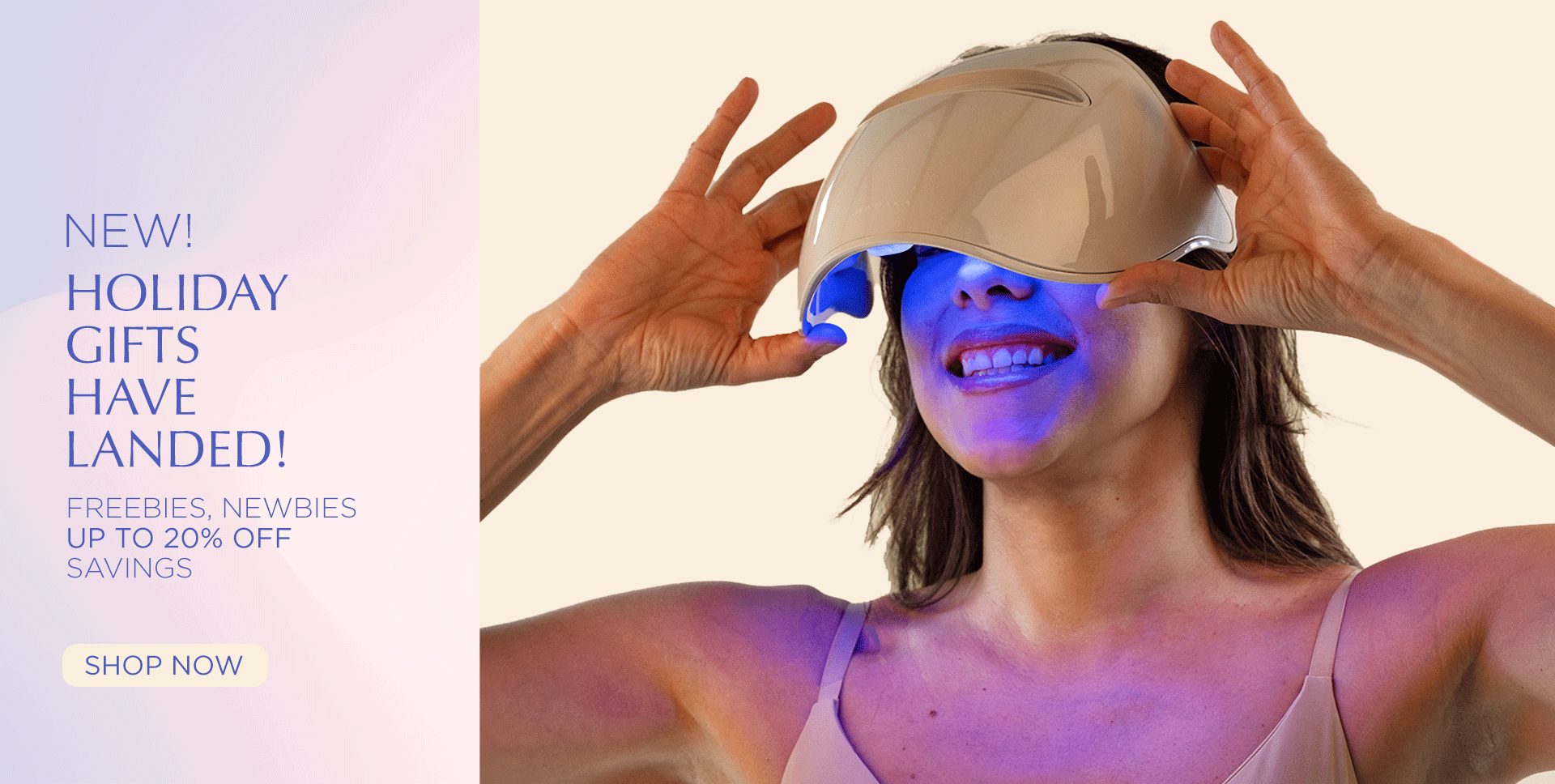 Person wearing a futuristic LED Light Therapy mask with glowing blue light, promotional text for holiday gifts.